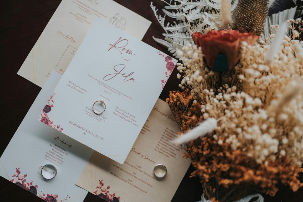 Beautifully designed wedding invitations paired with a rustic bouquet for a natural touch.